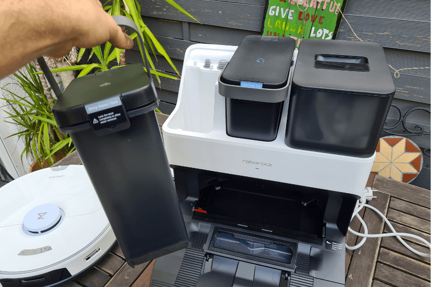 Dirty water tank of Roborock S7 Pro Ultra Station is held in hands.